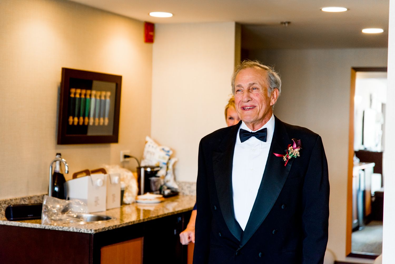 dad in tuxedo smiles during first look at his daughter on chicago wedding day