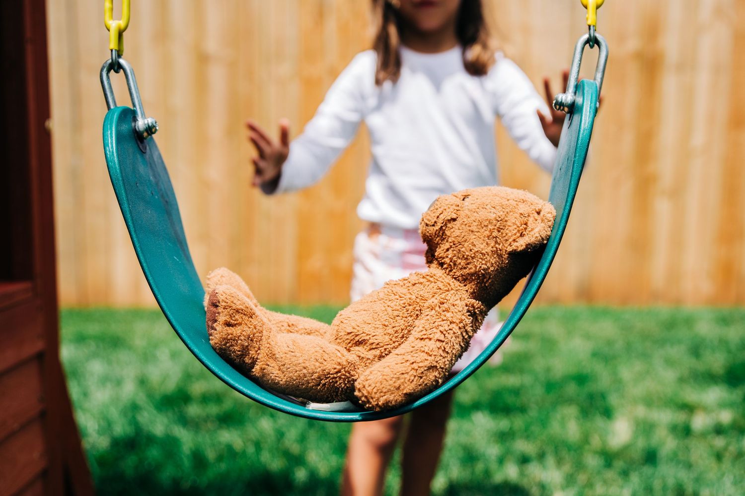 Teddy bear on a swing
