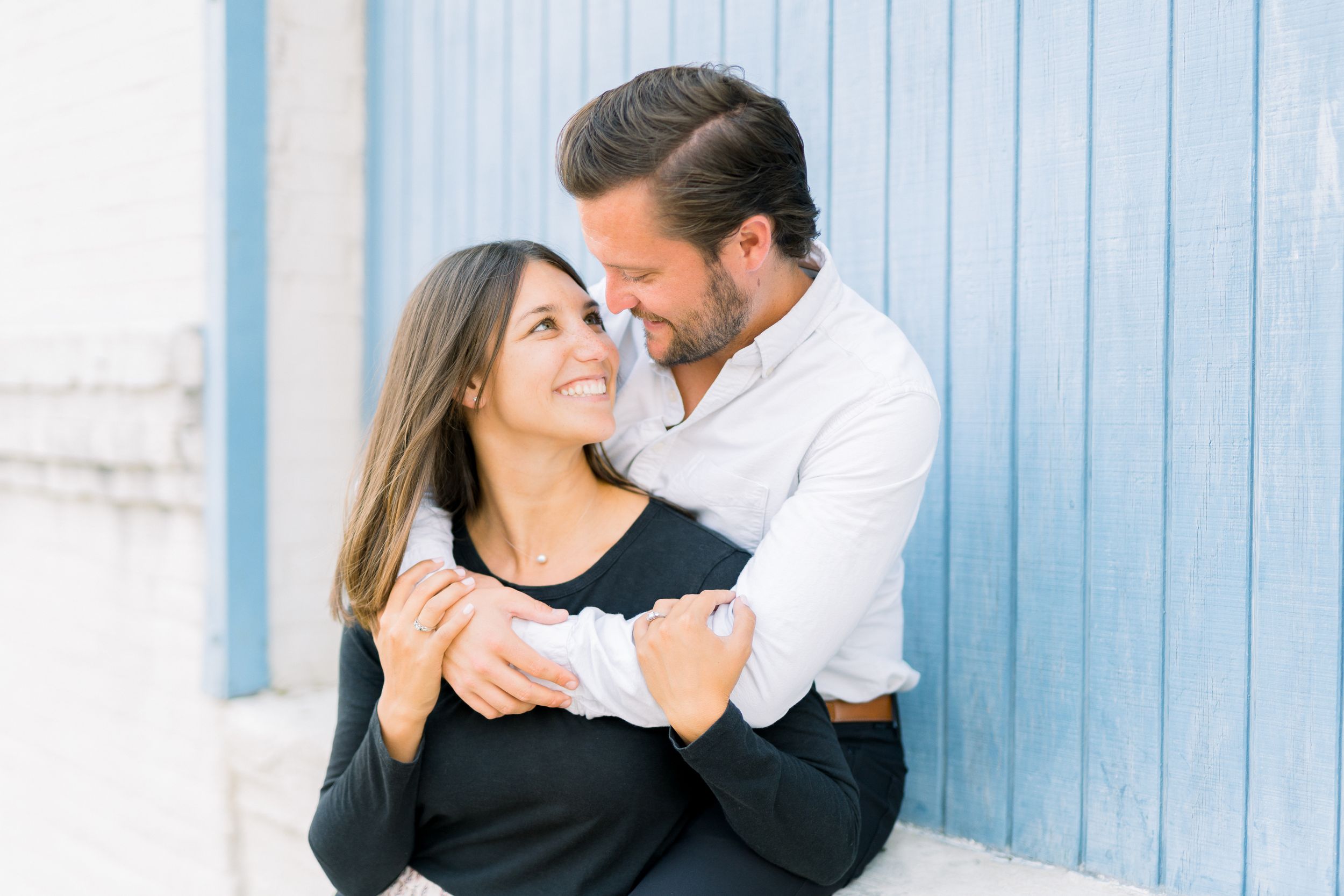 Des Moines Engagement photos in downtown Des Moines, Iowa with light and airy photographer Nicole Laing