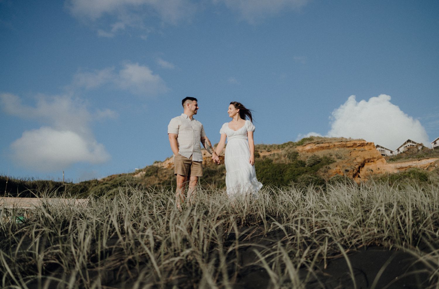 Couple in their engagement shoot in Karioitahi Beach with Apertured Media-Auckland Wedding Photographer