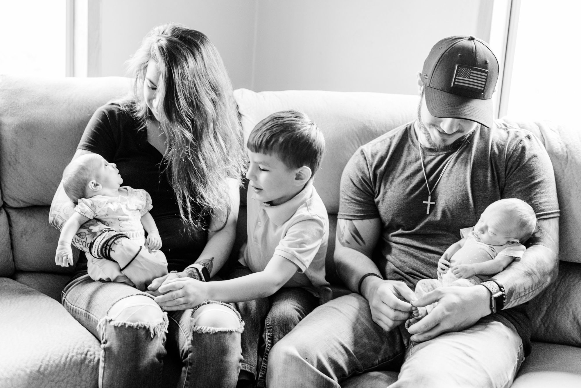 Family holding newborn twin girls in black and white in Corsica, Pennsylvania