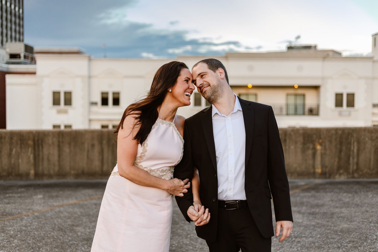 Man and woman on top of a parking garage for their engagement in Chattanooga.