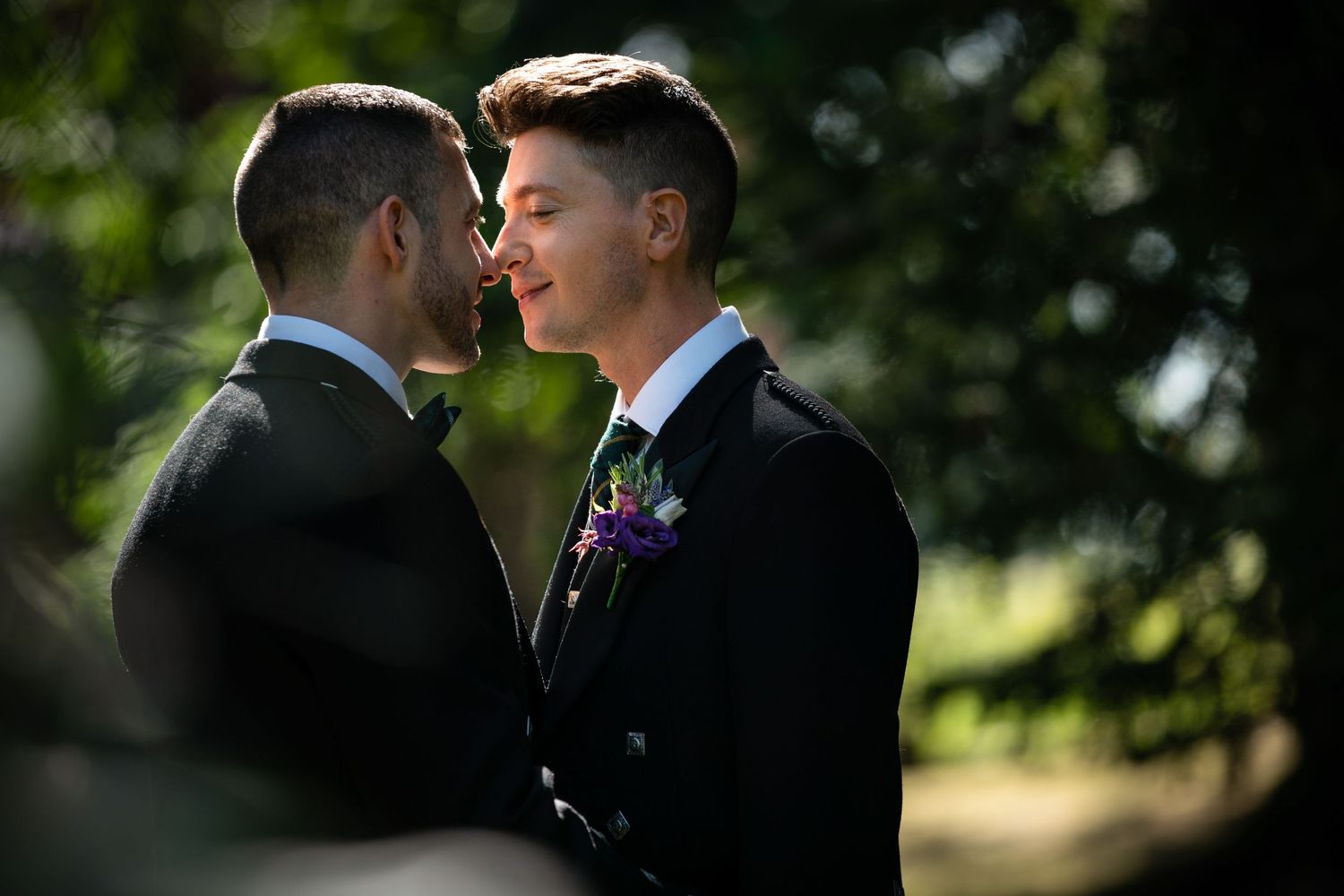 handsome couple share a romantic moment in a secret garden