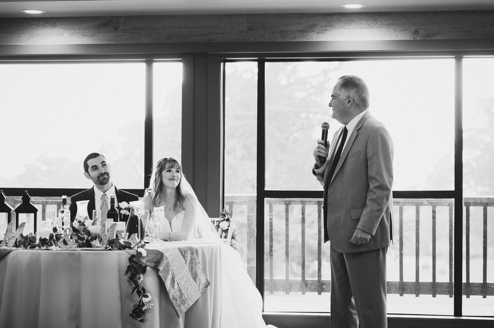 father of the groom giving a toast to the couple