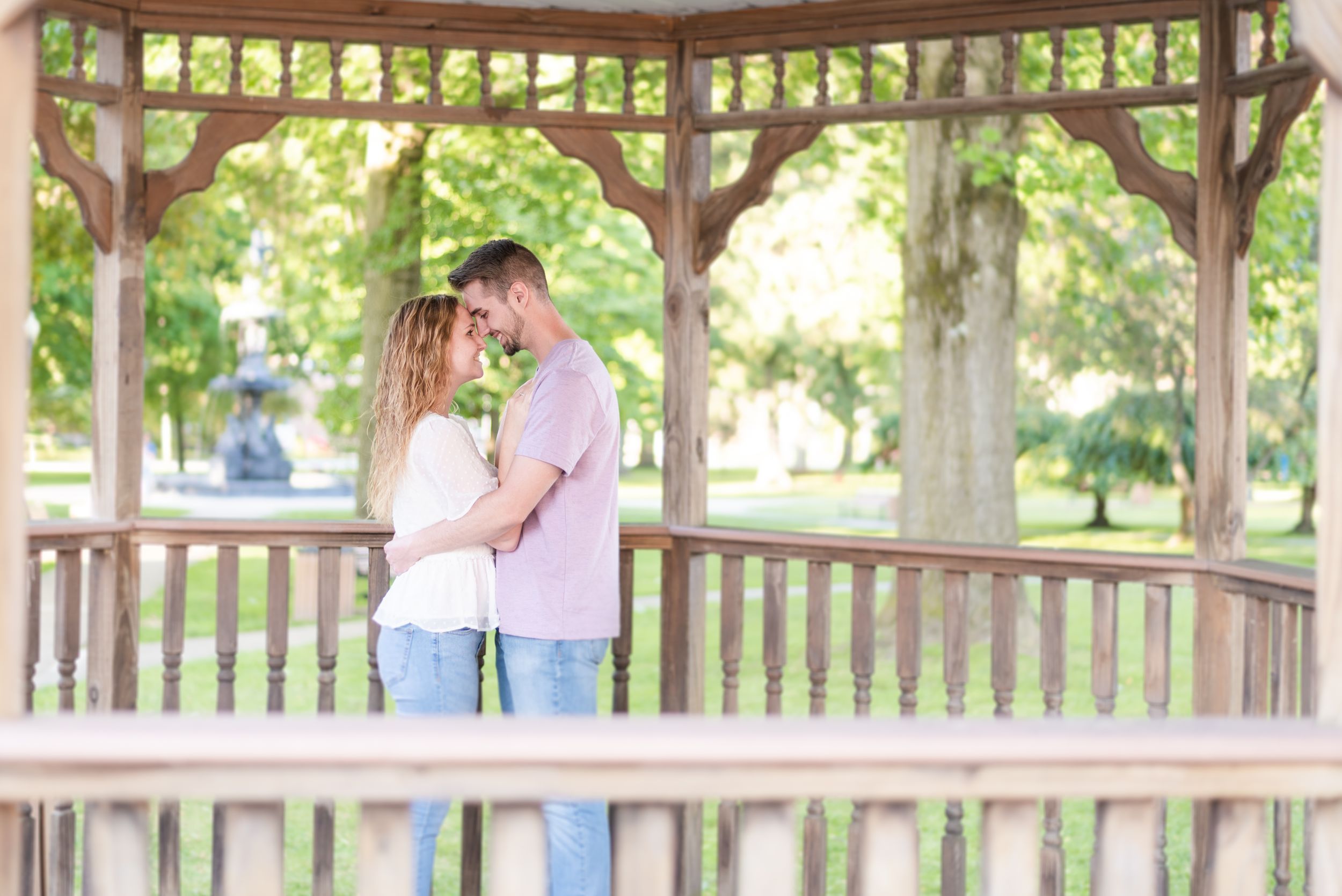 Couple standing in pavilion in park for engagement in Franklin Pennsylvania