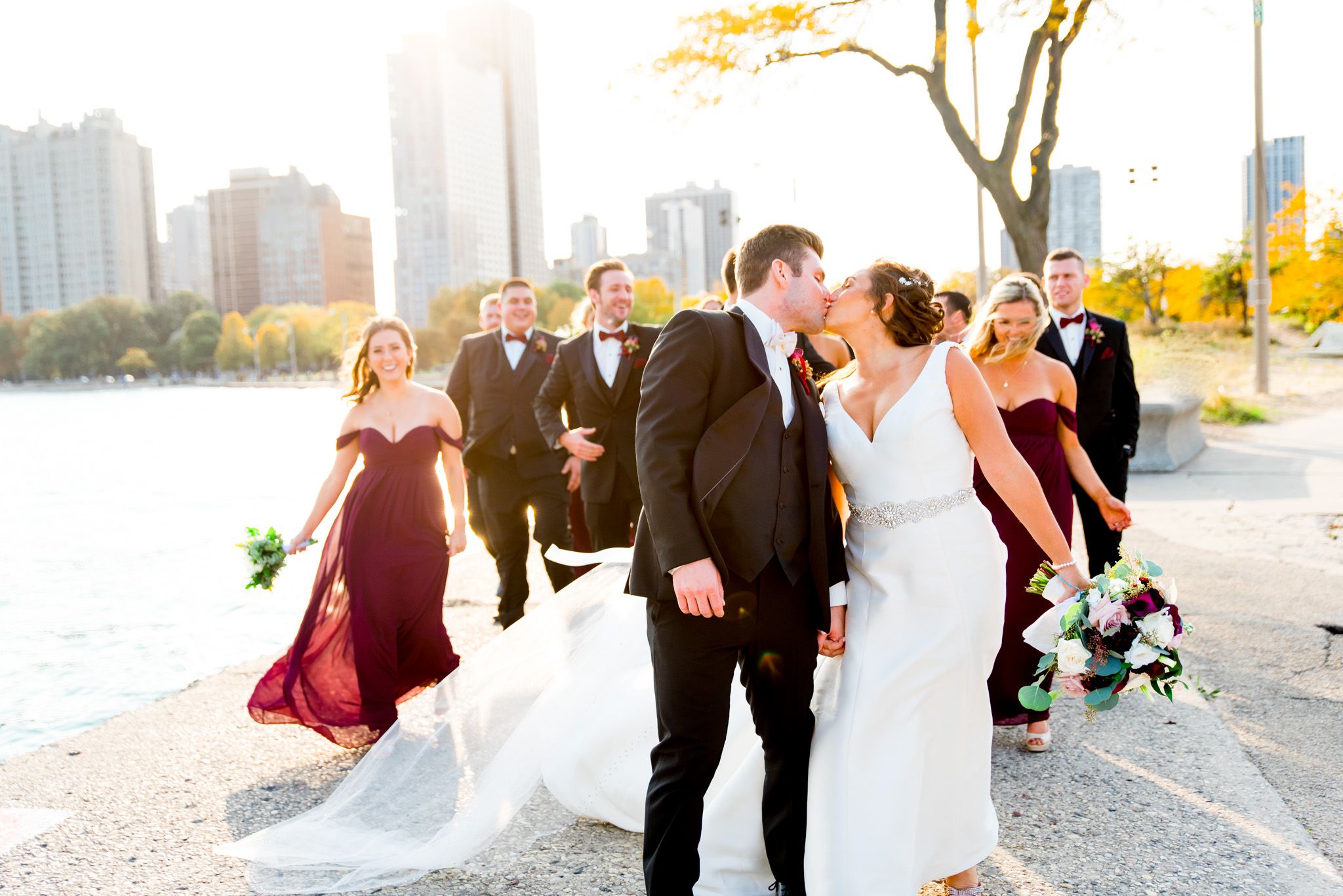 colorful chicago wedding photography documents wedding party walking alongside bride and groom