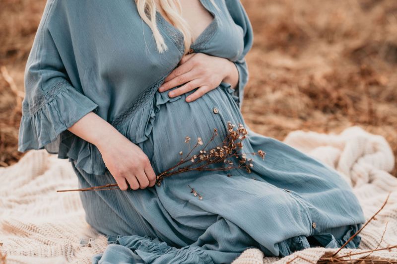 Blue jean dress in maternity photos