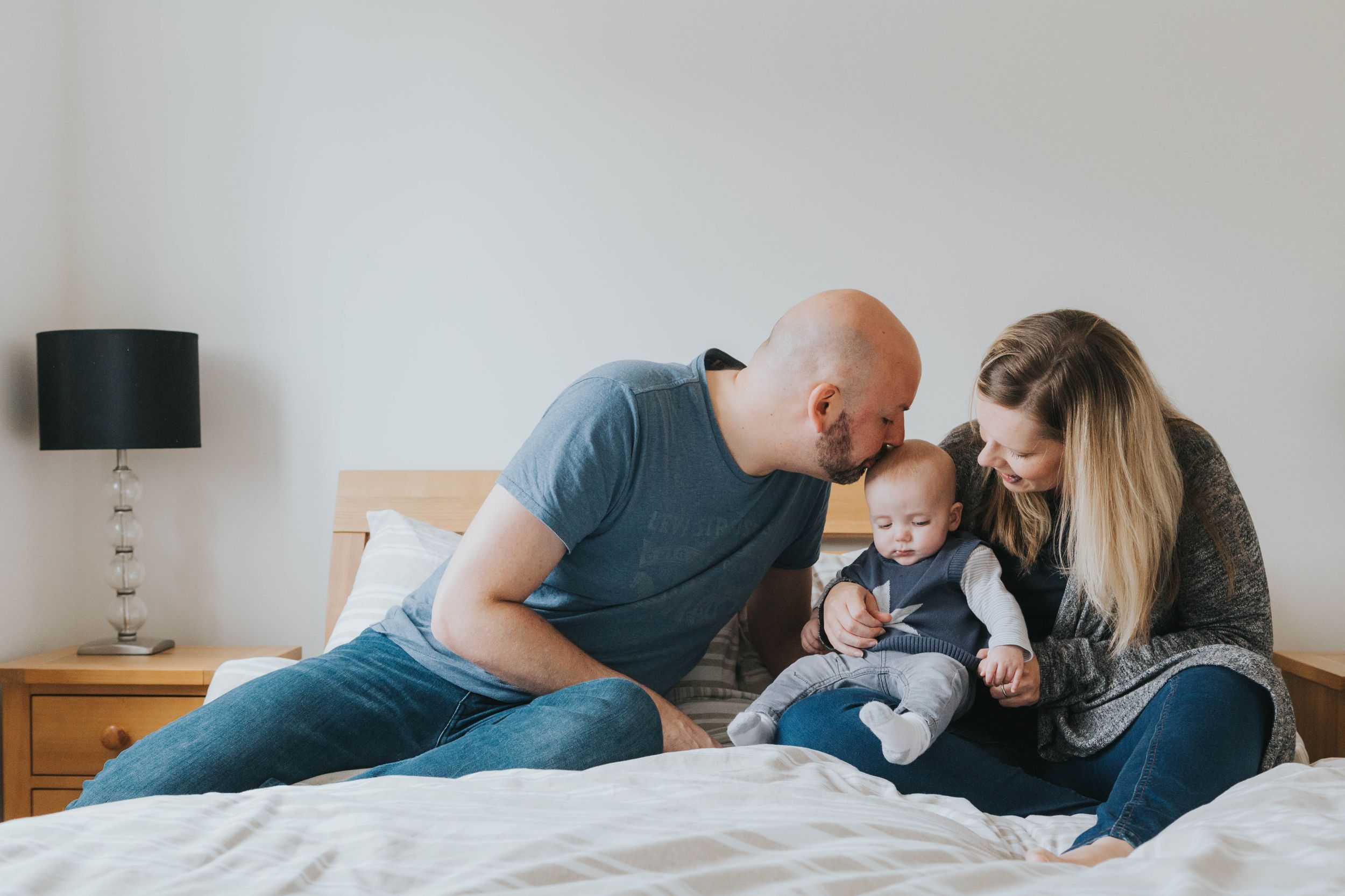 Family documentary at home photo shoot with a little baby boy and his parents.