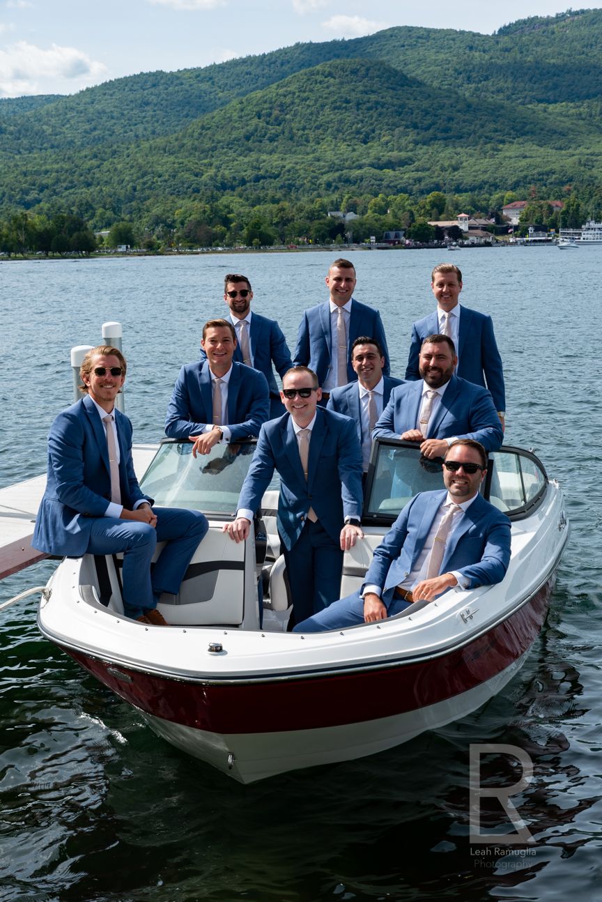 Leah Ramuglia Photography groomsmen on a boat in Lake Charles, NY, New York destination wedding