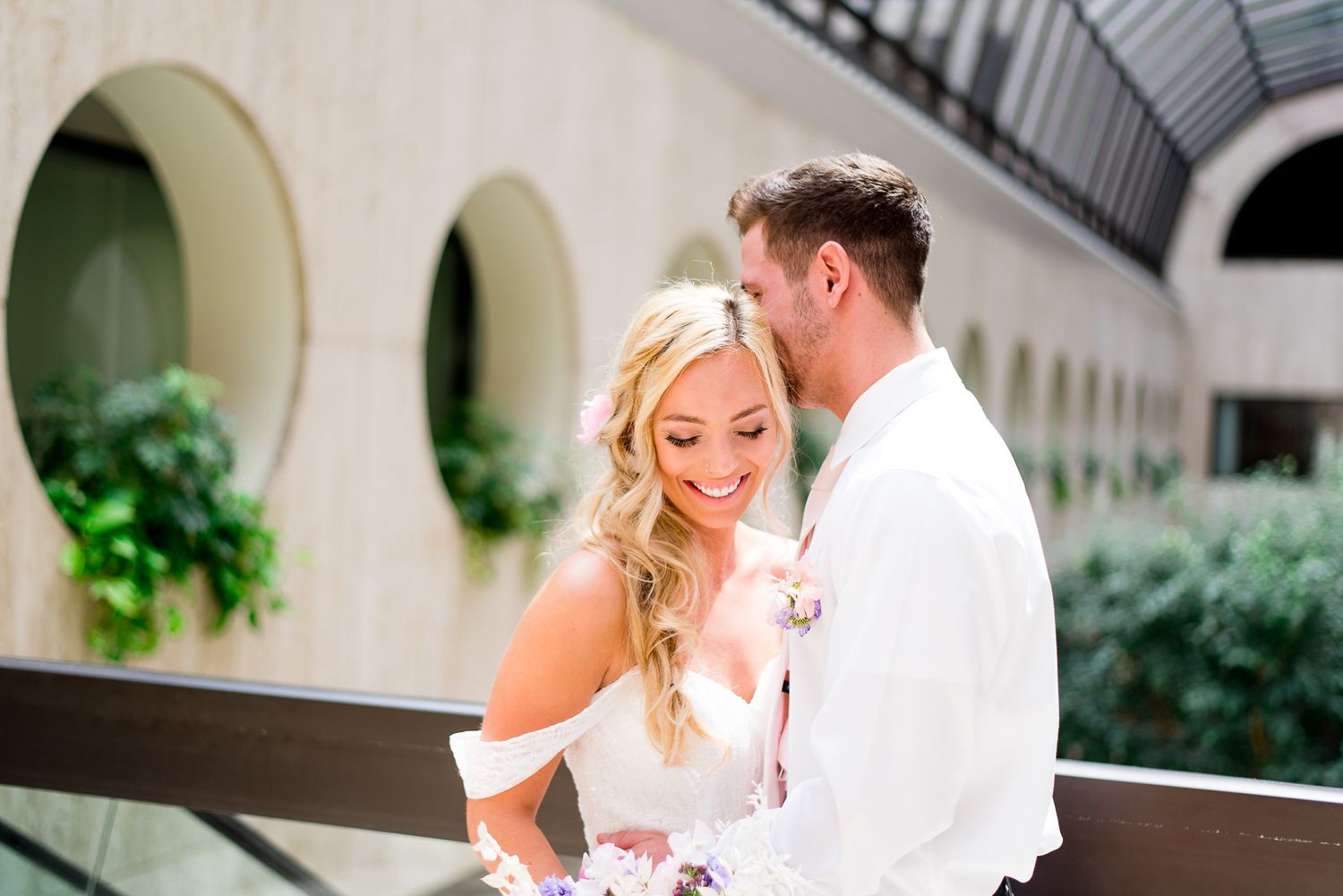 bride and groom at The Center Cincinnati smiling laughing and hugging