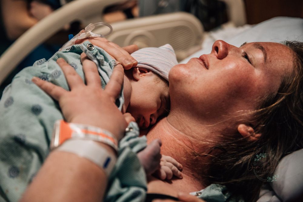 Mom cradles her newborn son after her birth at a hospital in Arkansas