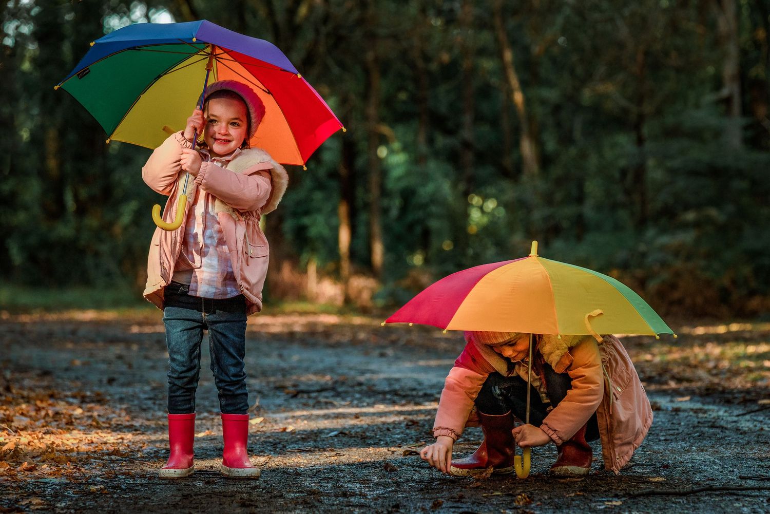 Two girls with rainbow umbrellas by Melbourne photographer Kate Cashin