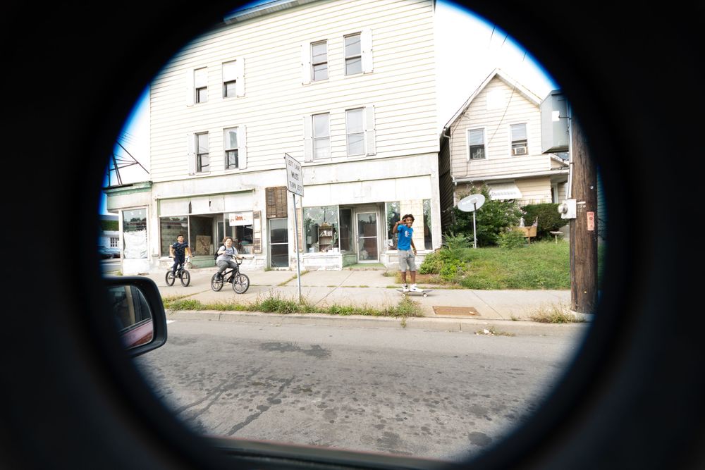 Street youths with lens cap @ 8mm. Binghamton, NY