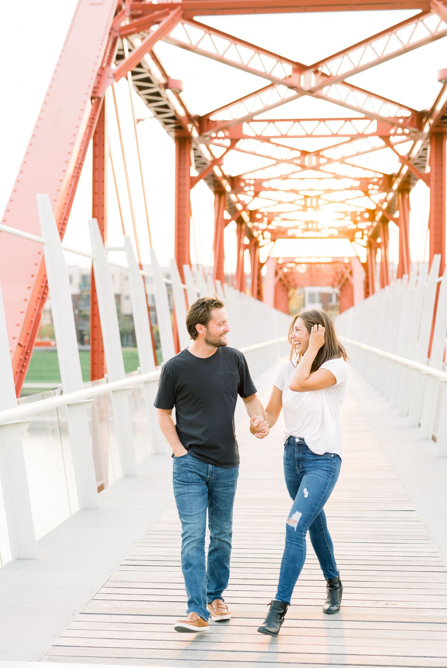 Des Moines Engagement photos in downtown Des Moines, Iowa with light and airy photographer Nicole Laing