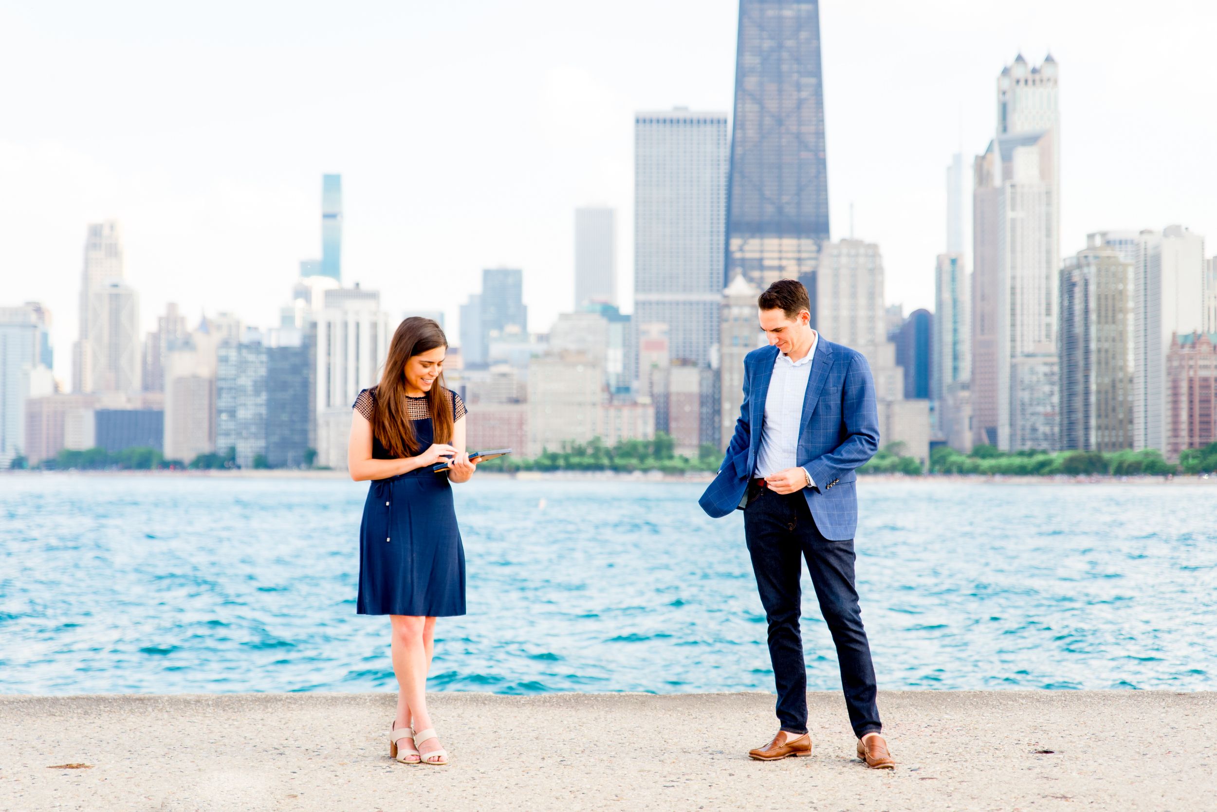 woman reading note from man before he proposes at North Avenue Beach