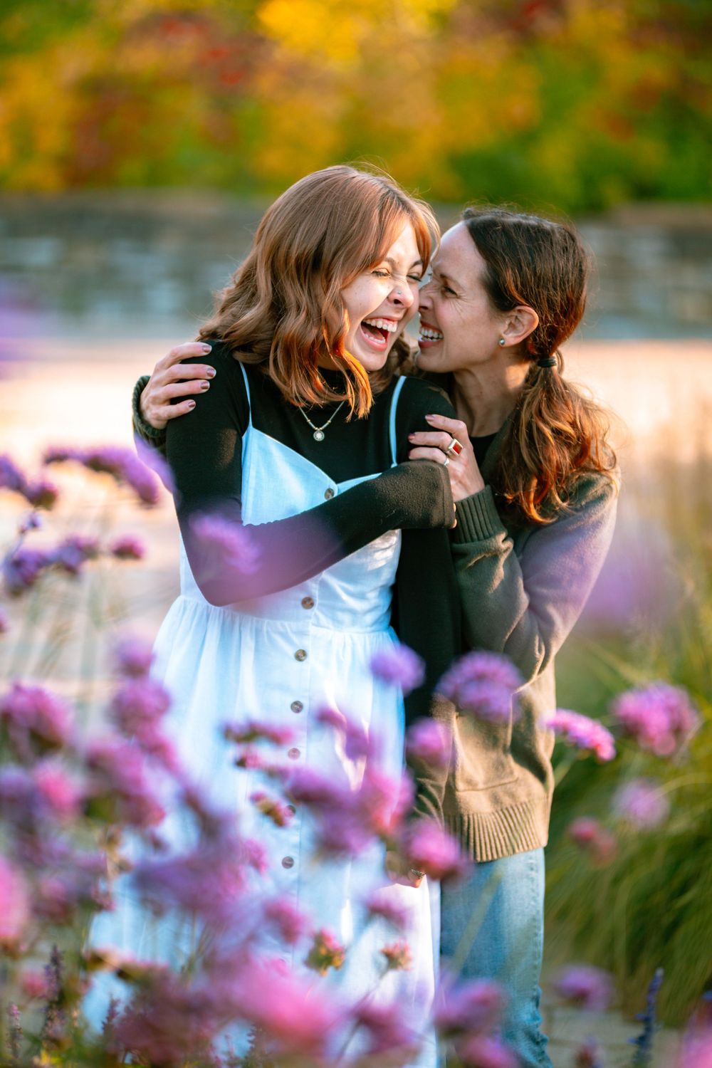 senior girl and mom laughing together