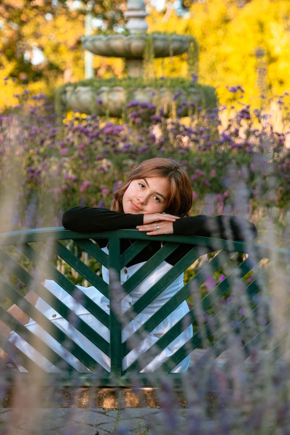 senior girl resting on a bench