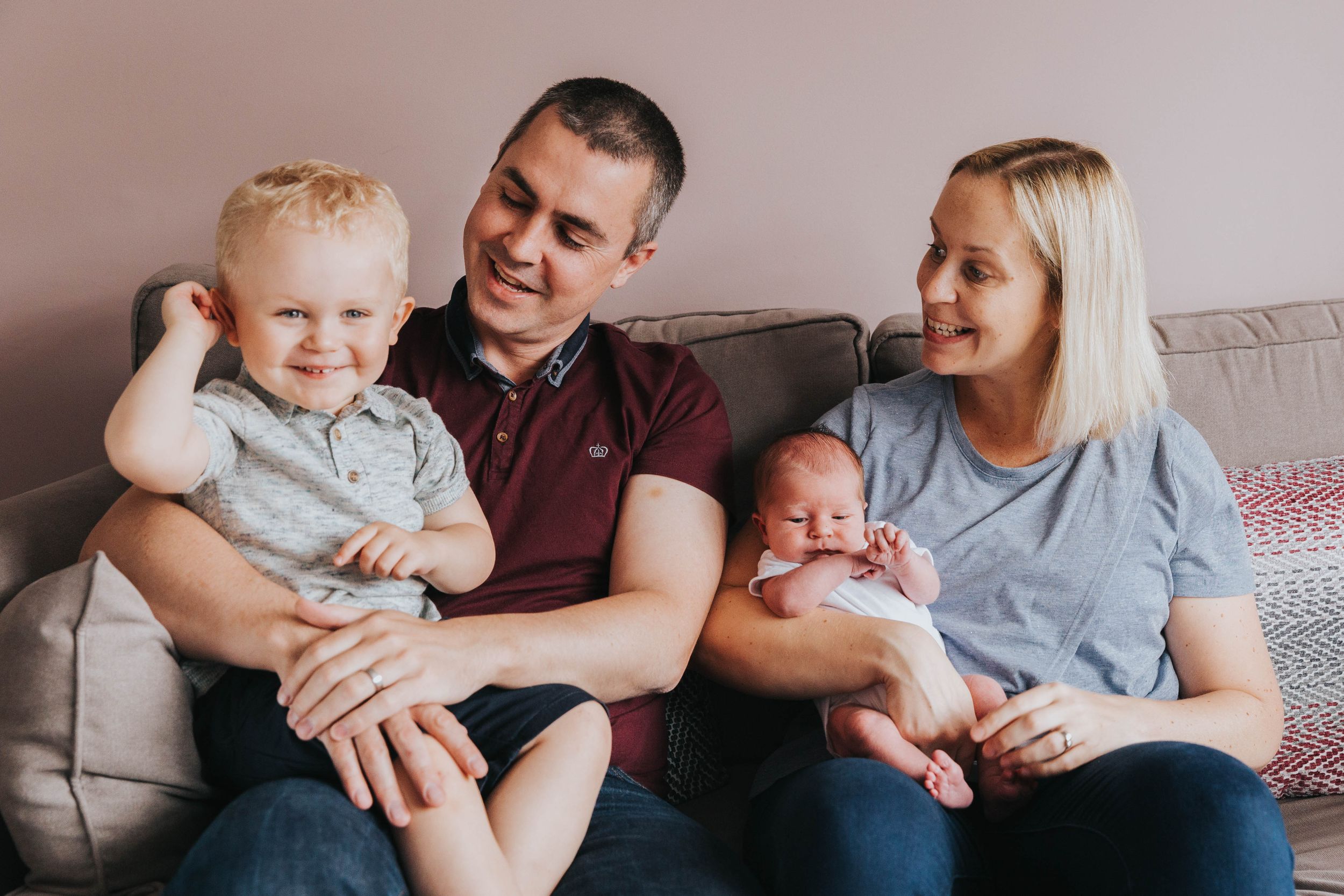 Hornchurch family of four sitting on sofa