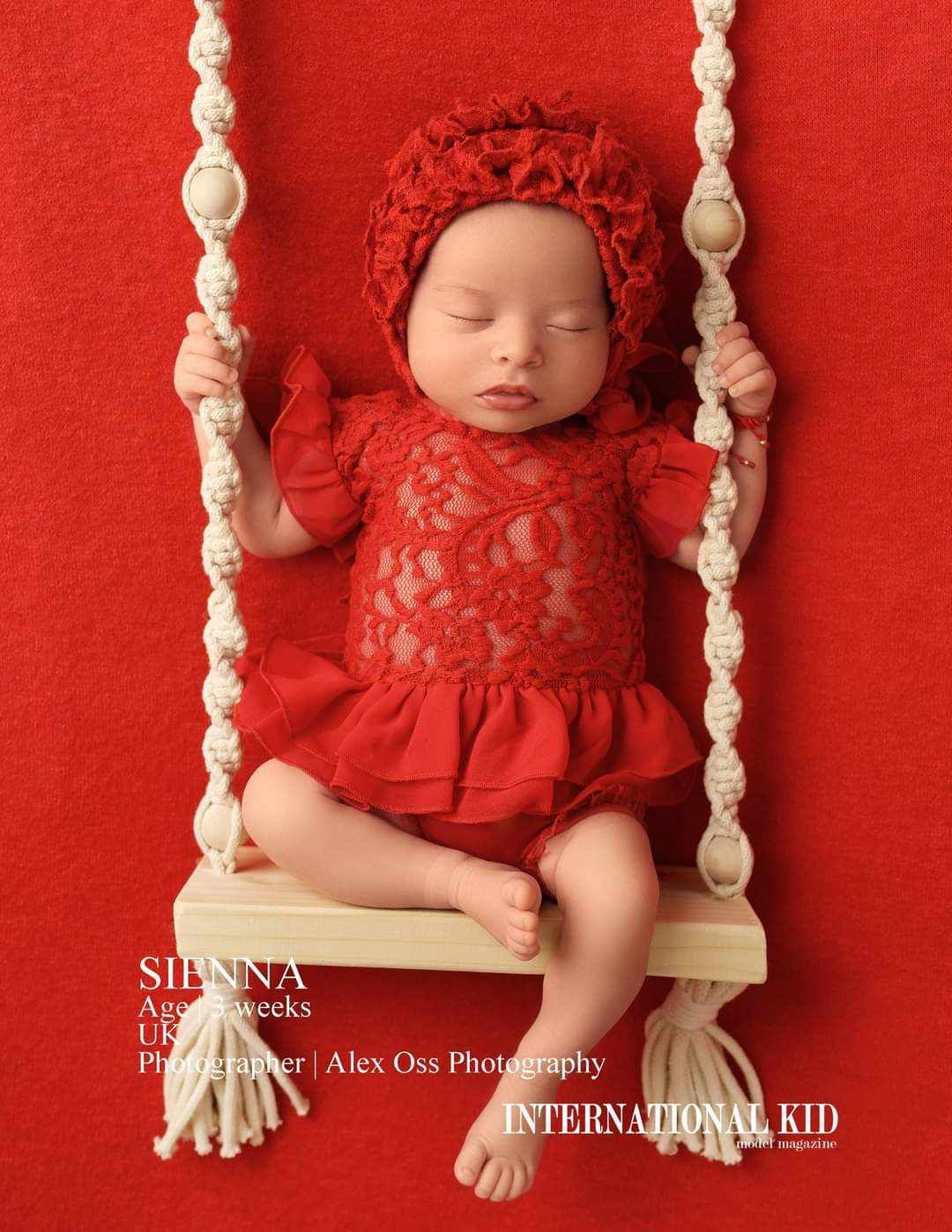 Newborn baby on the swing during newborn session in studio
