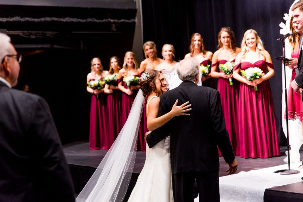 chicago bride embraces her father at the end of the aisle