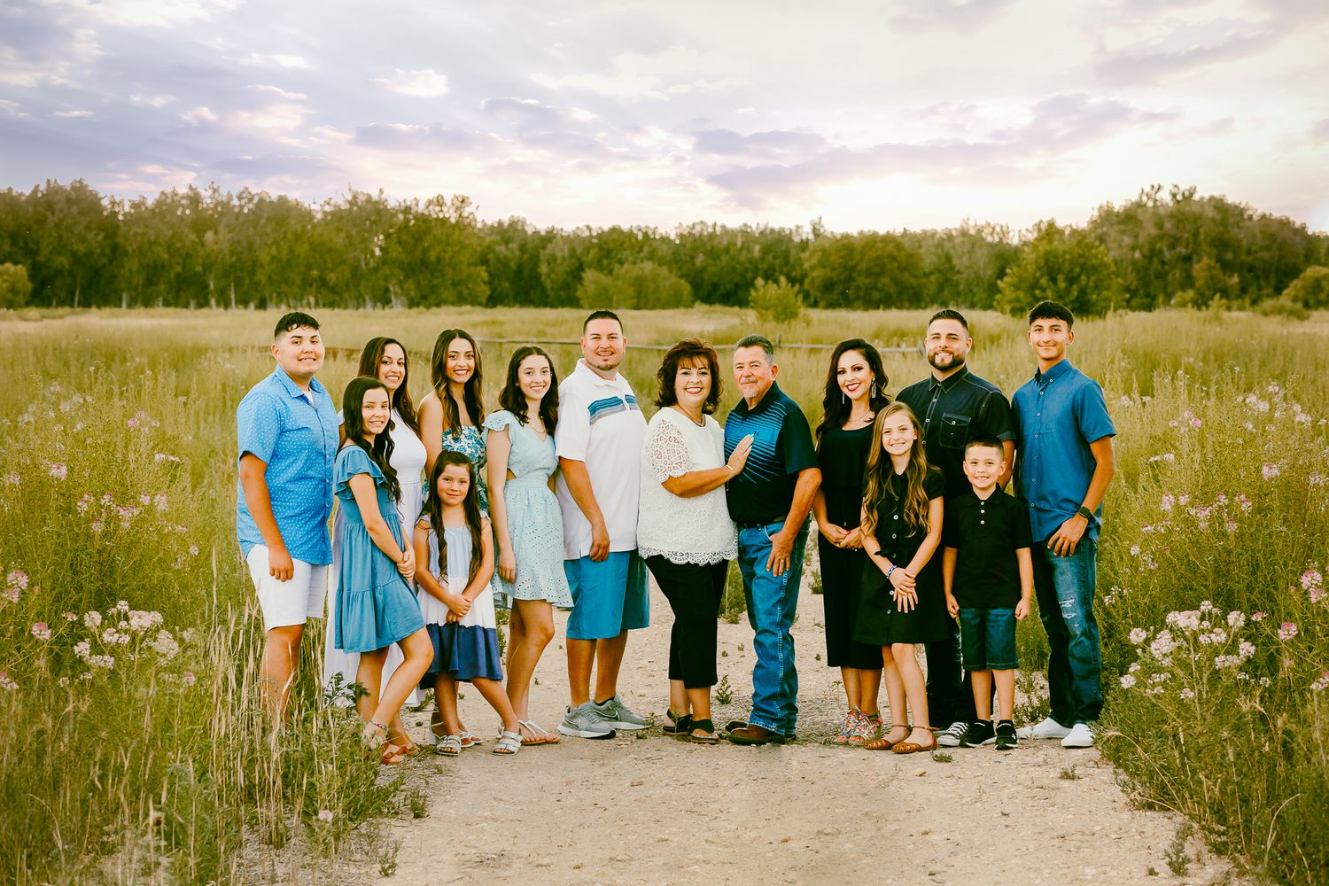 extended professional photo session in rocky mountains family of 15 posing in the mountains during sunset golden hour time. liz rivas