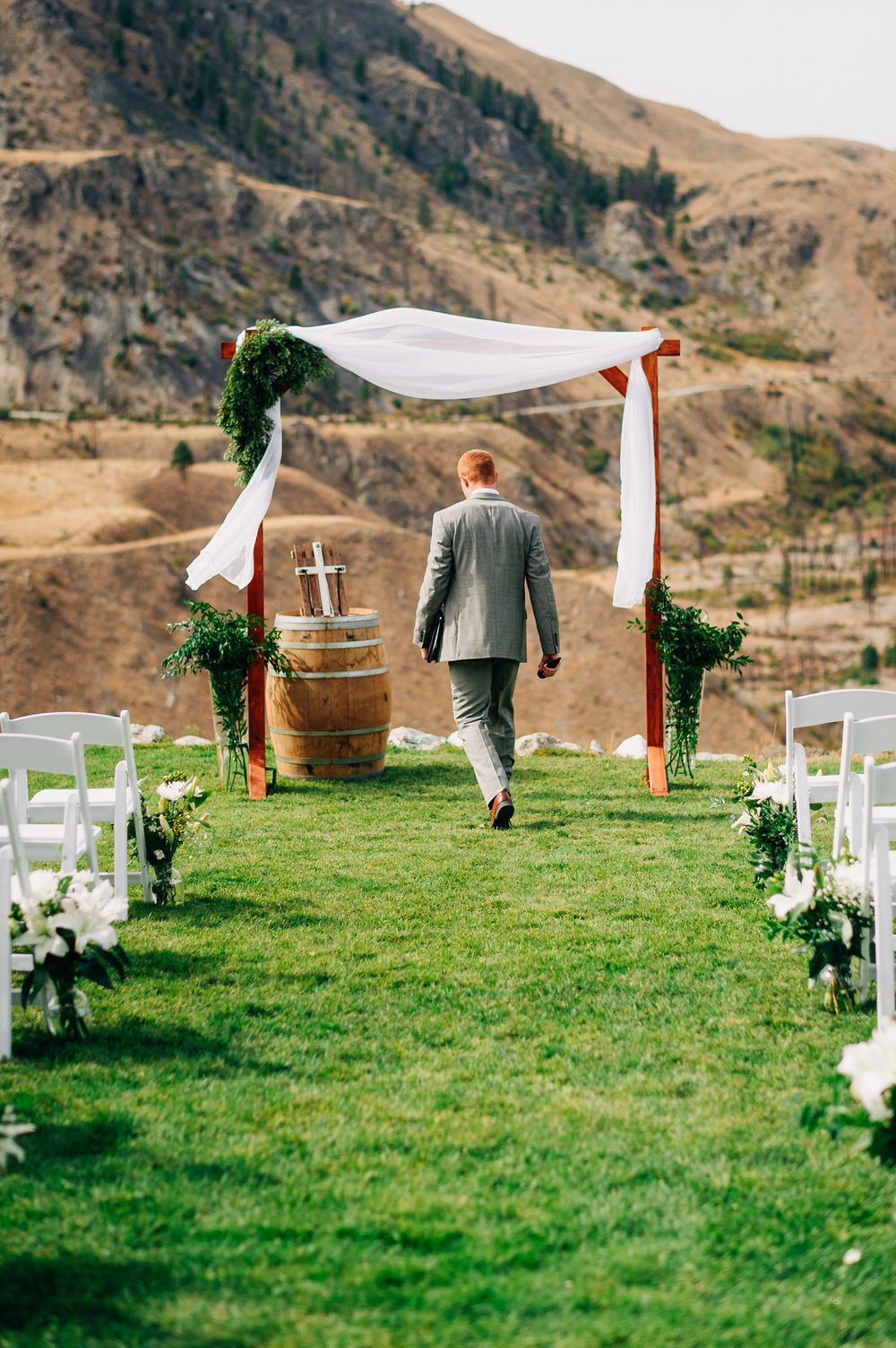reverend walking towards wedding alter before a prayer to Jesus Christ