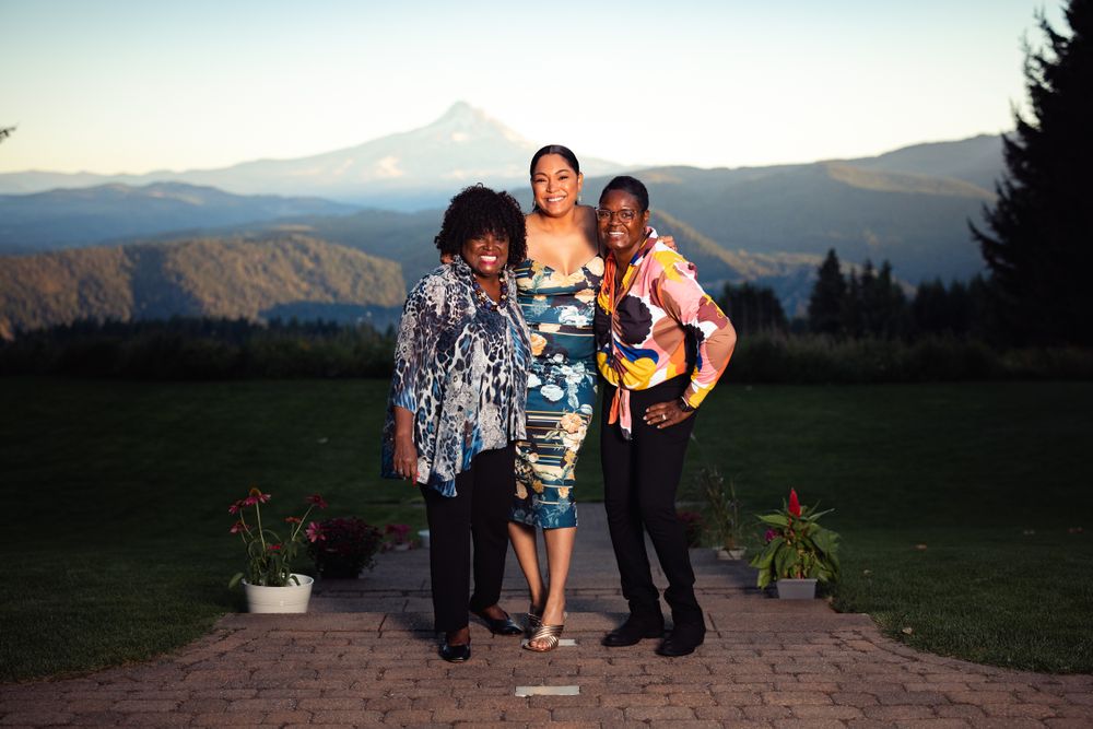 3 lovely ladies enjoy the wedding ceremony site at Gorge Crest Winery