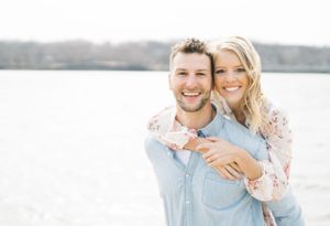 Light and airy film lakeside dock engagement session at Gray's Lake in Des Moines, Iowa