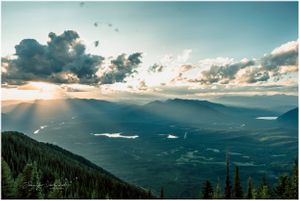 view of valley at sunset from mountain top in columbia falls montana