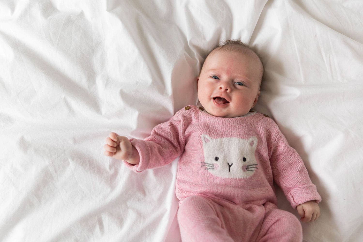 two month old baby girl smiling