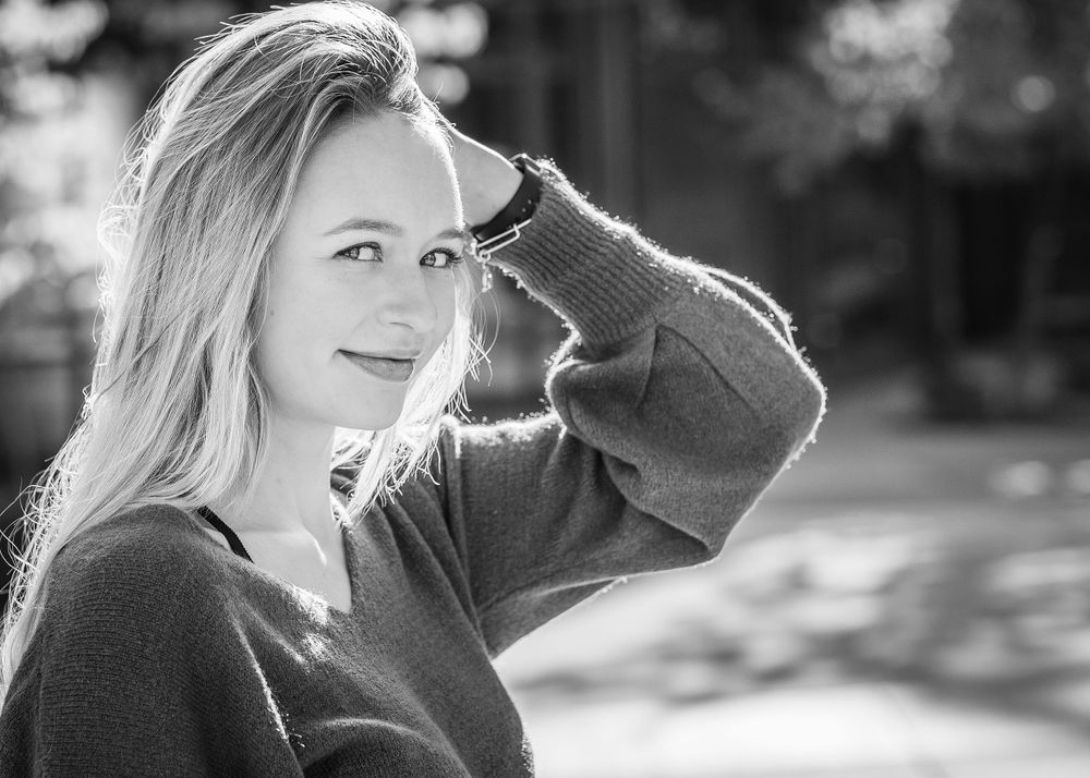 Senior girl glances at the camera
