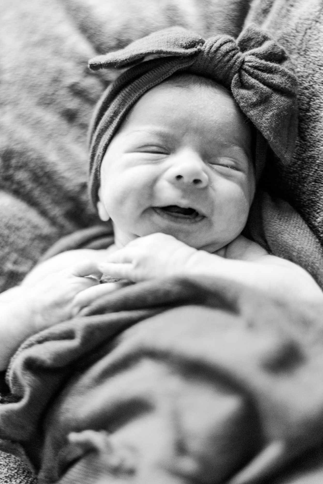 Lifestyle newborn baby in a pink wrap in Pittsburgh, Pennsylvania