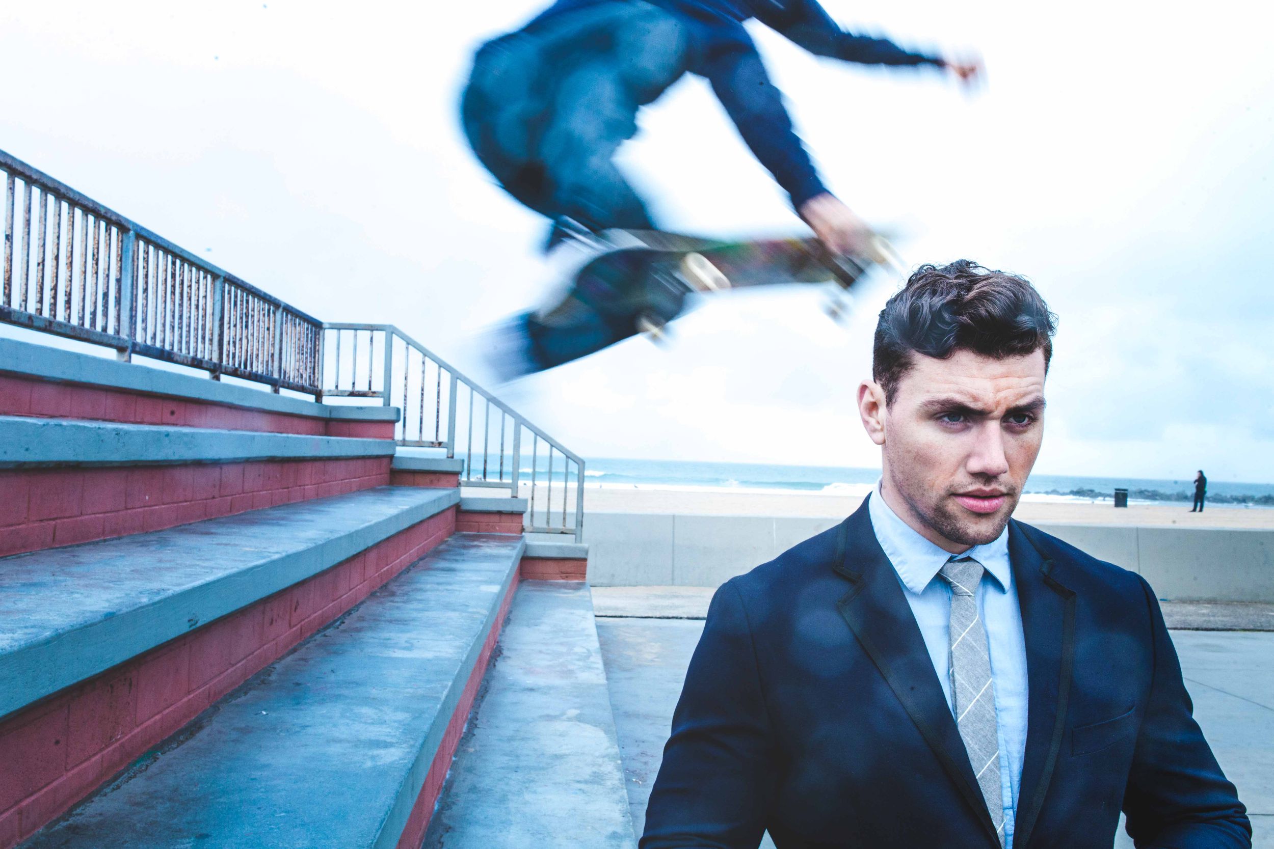 Actor Christian James Smoking in Suit Men's Fashion Trends Handball Court Venice Beach Interview Magazine