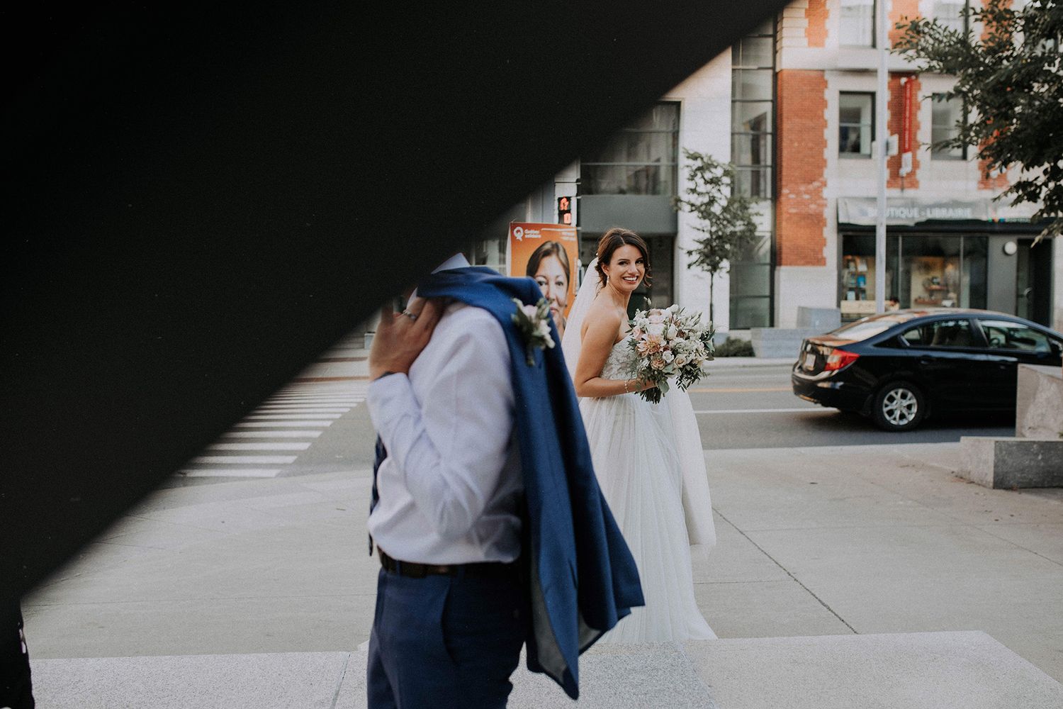 Bride and groom casualy walking in Montreal streets during their elopement in Canada