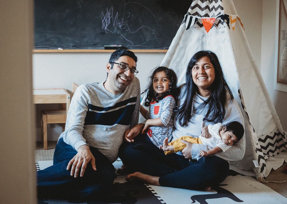 traditional family photo with newborn Seattle playroom
