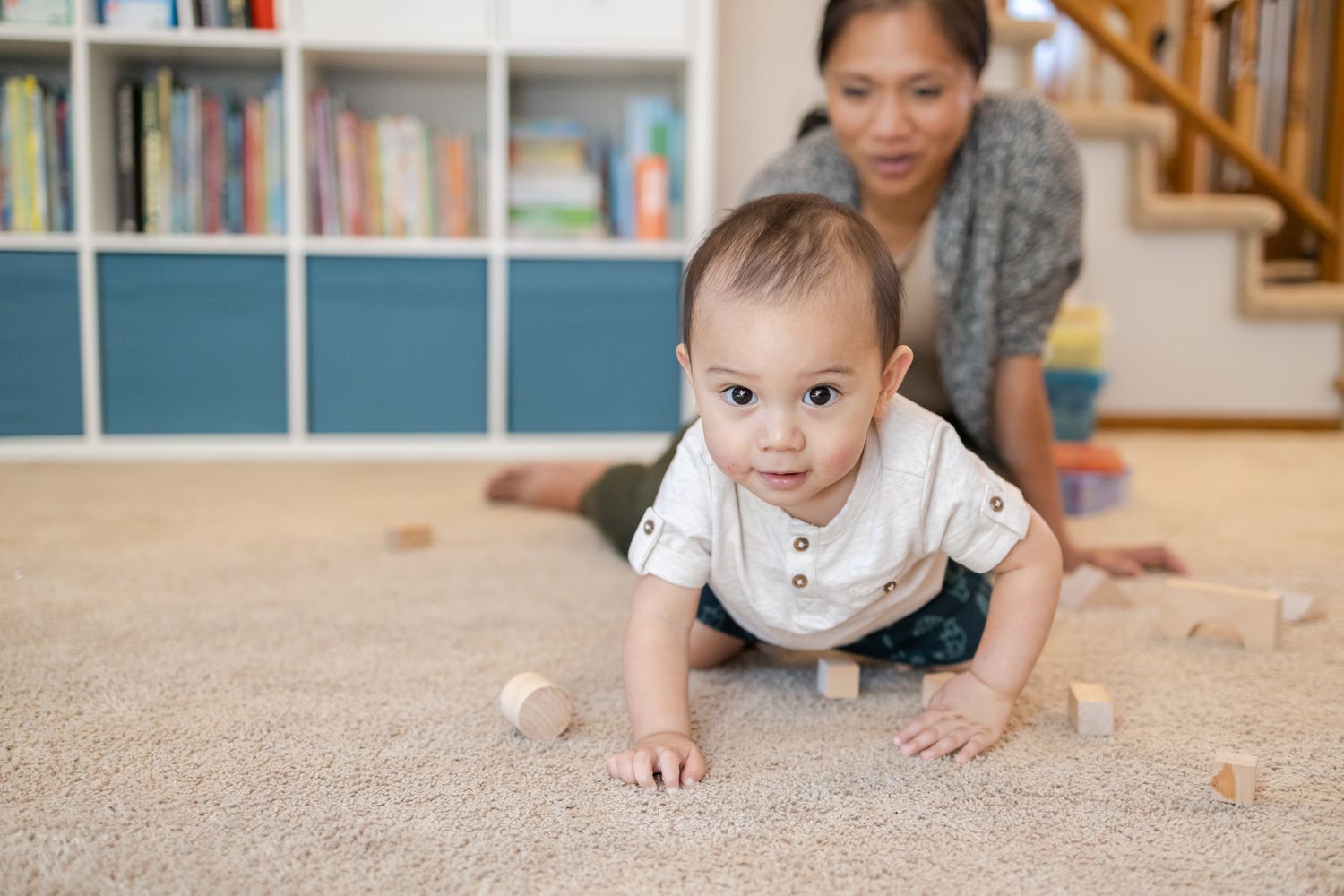 baby crawling towards camera with block around and mom Homeschooling entrepreneur mom Maple Valley, WA branding photo