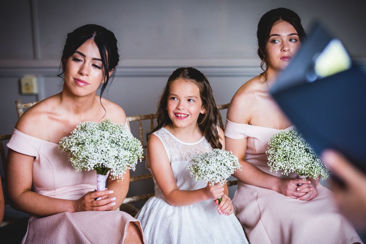 bridesmaid smiling through wedding ceremony