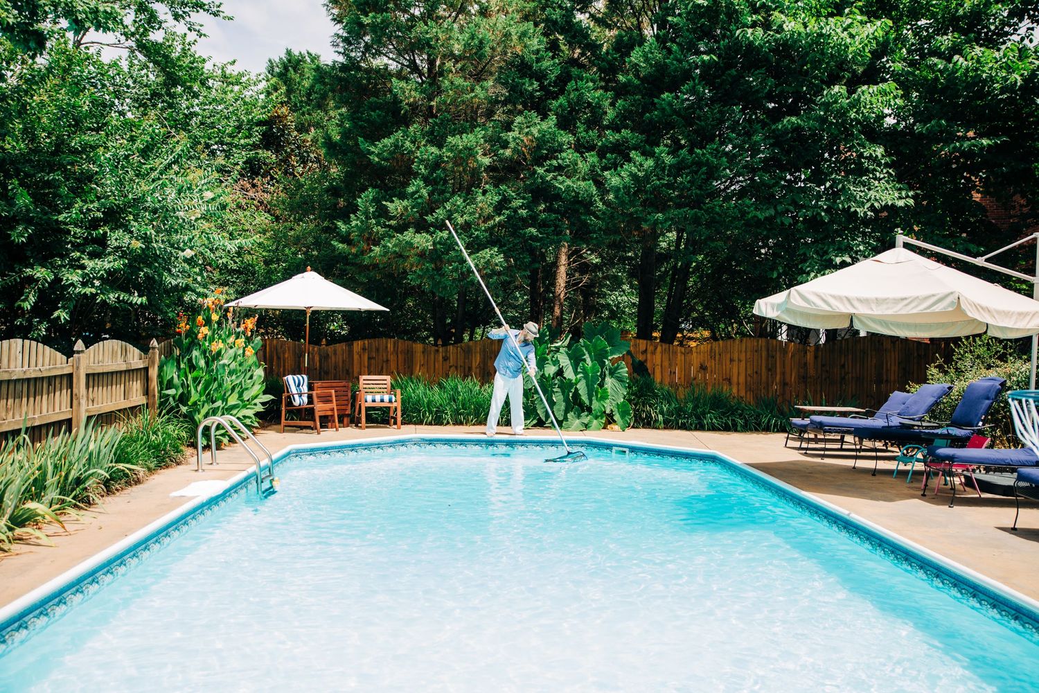 Dad cleaning pool for Charlotte, NC family photos
