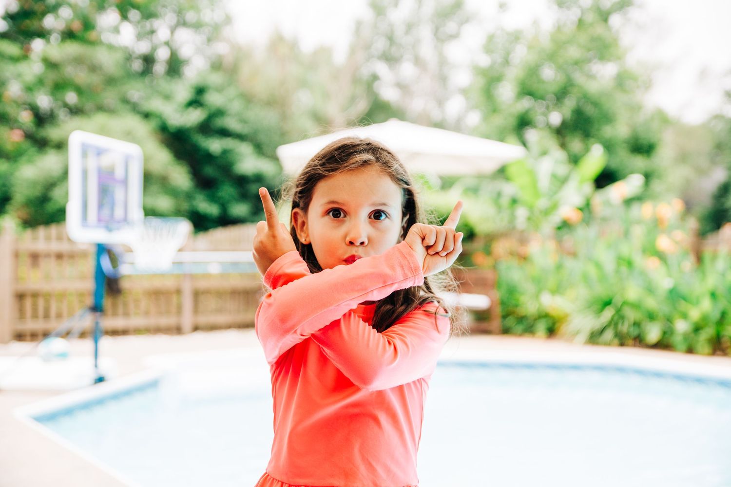 Young Charlotte girl making a silly face during family photos