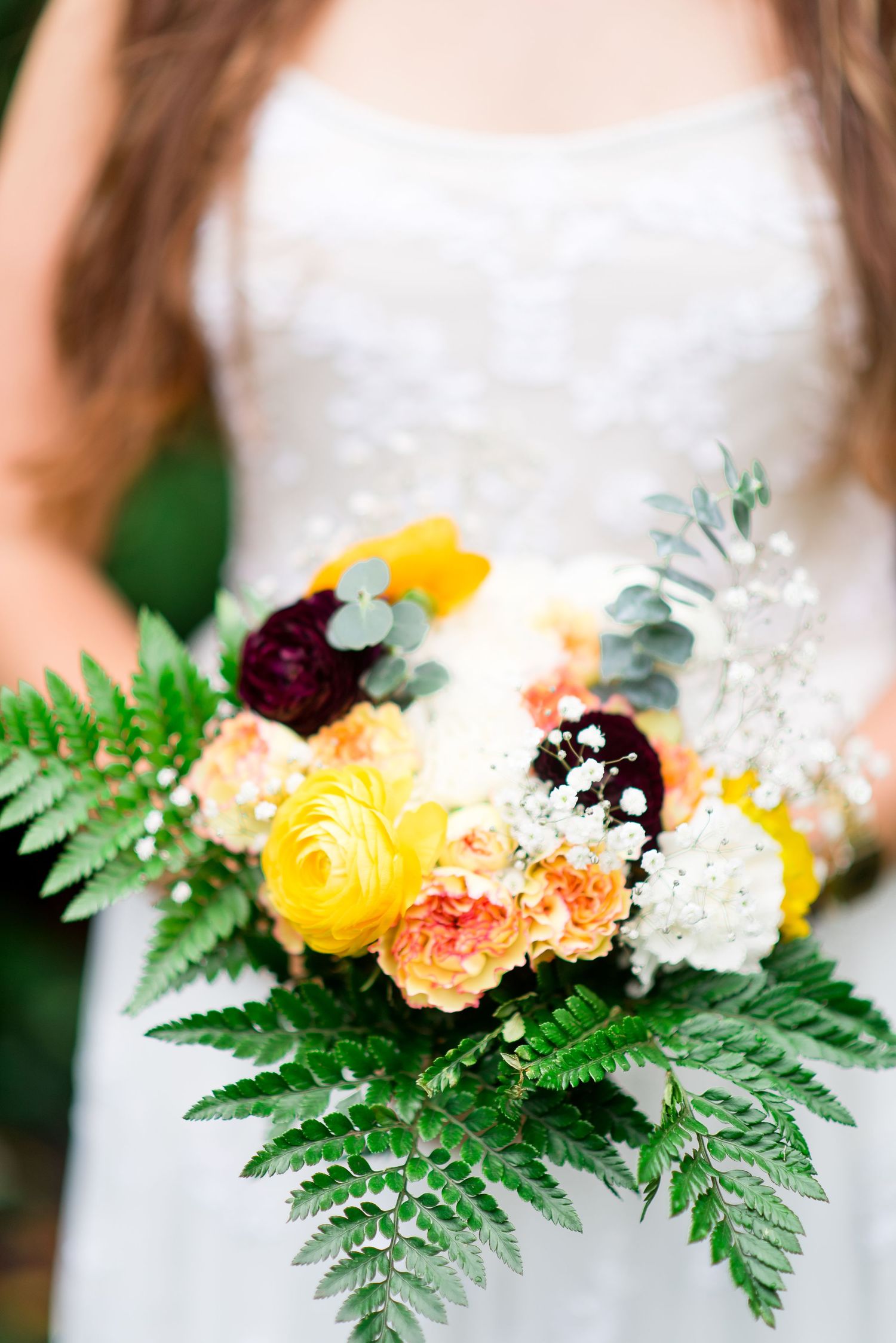 yellow, maroon, peach, and white wedding bouquet
