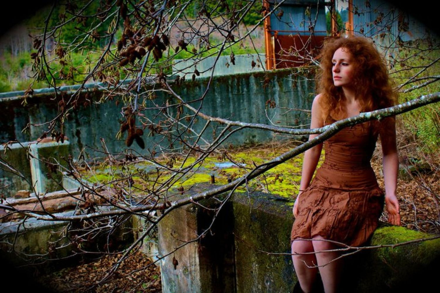 Some of Elise Odom's early photography work depicting a self portrait of Elise in nature sitting upon a cement wall