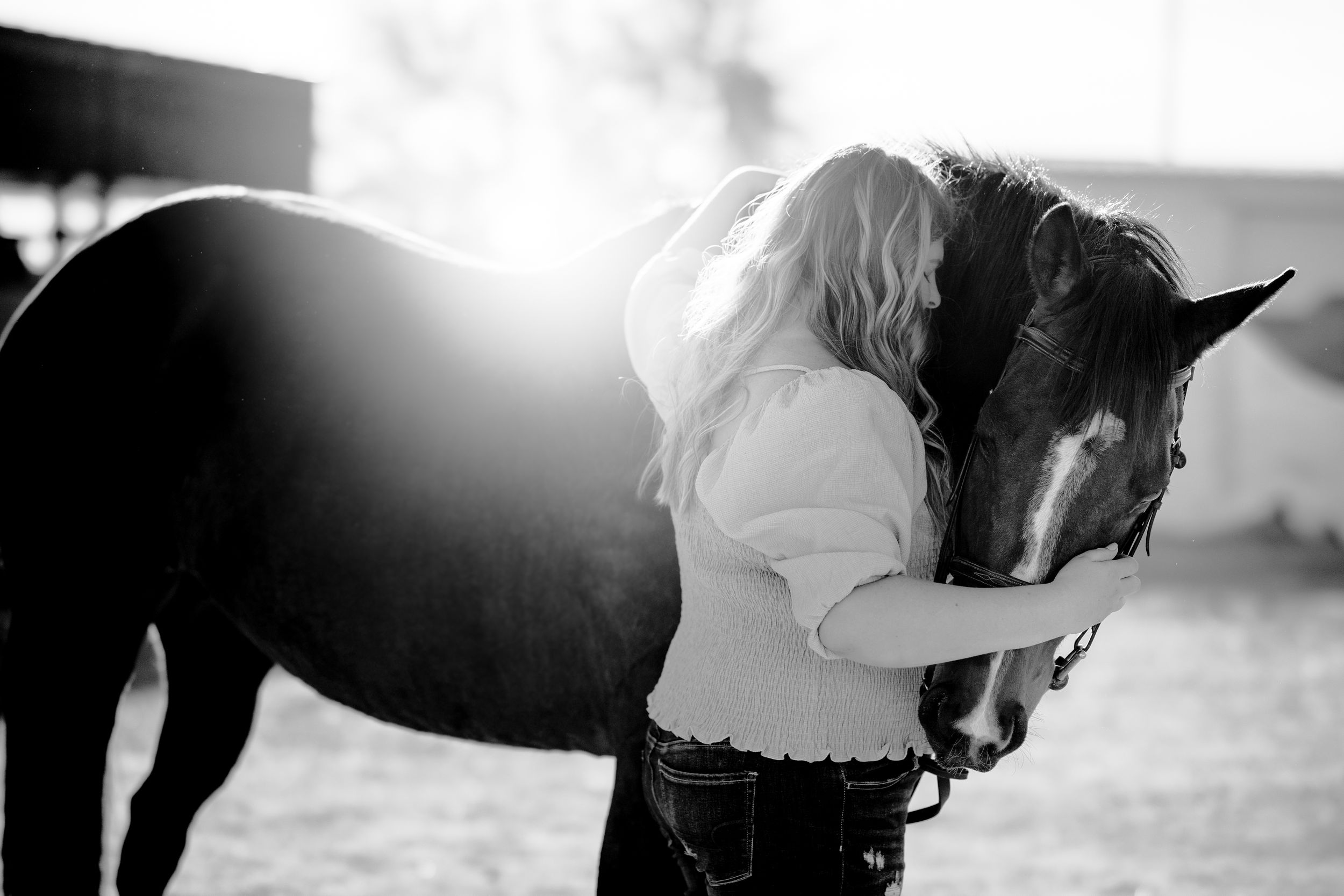 black and white photography horse and rider bond connection senior portraits