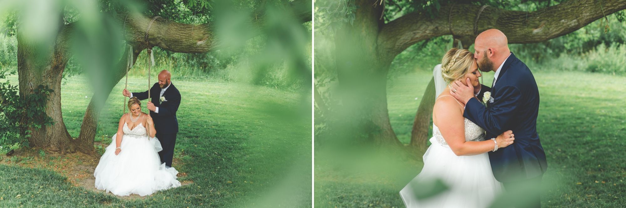 Bride sitting on a tree swing with the groom standing then groom kissing her forehead while they both stand.