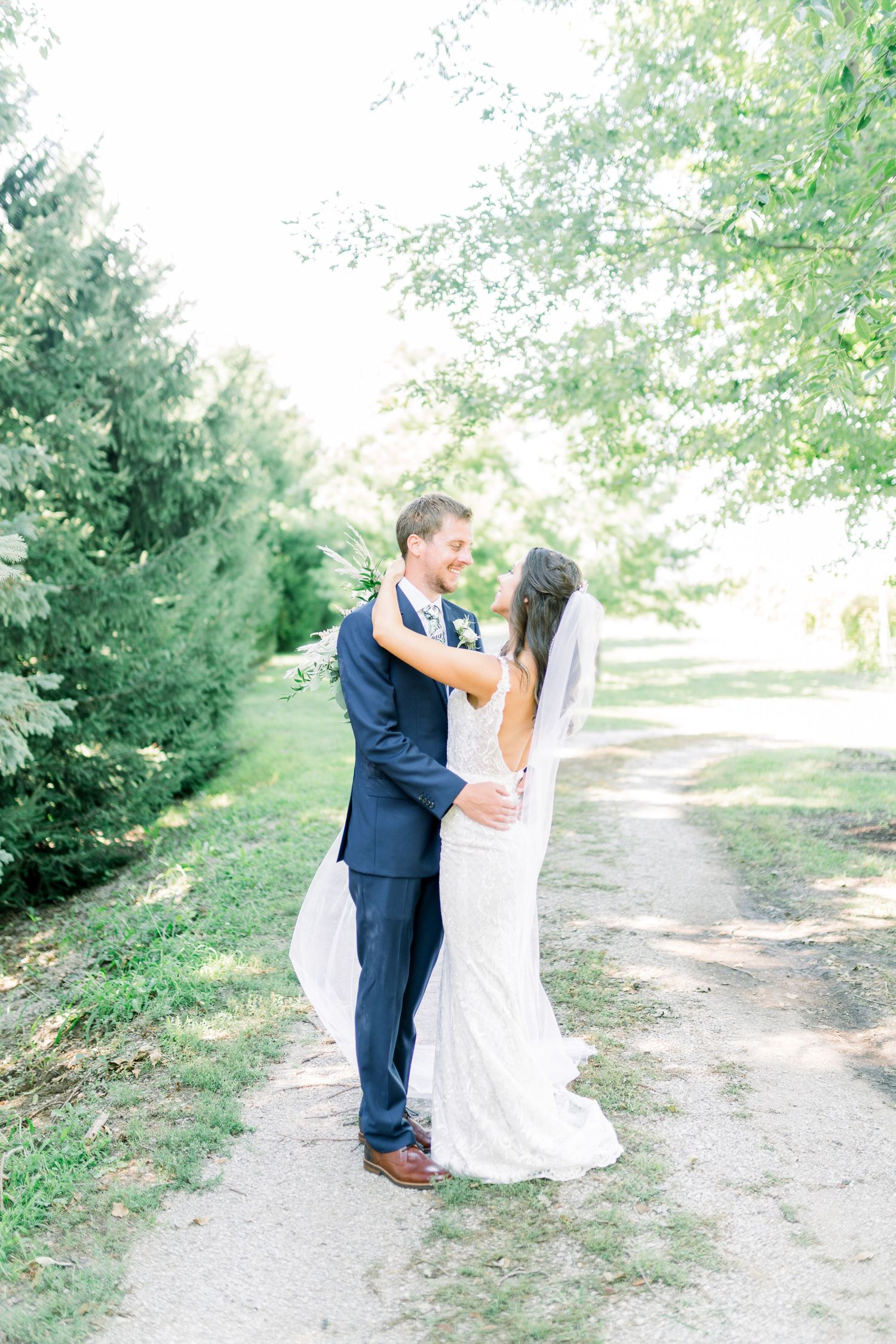 Vineyard photos with white willow events at Prairie Moon Winery wedding in Ames, Iowa