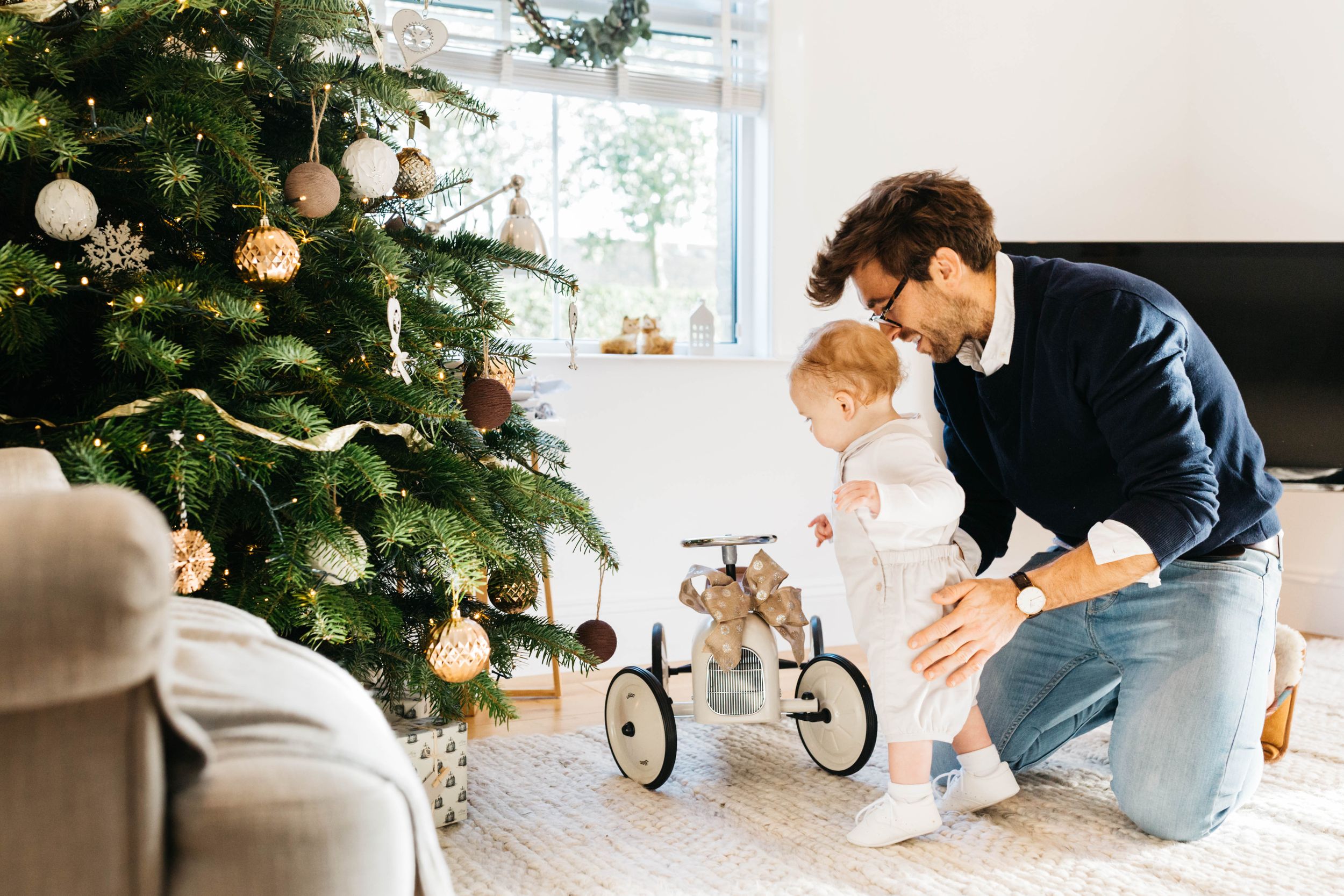 dad showing his baby boy son vintage kids toy car