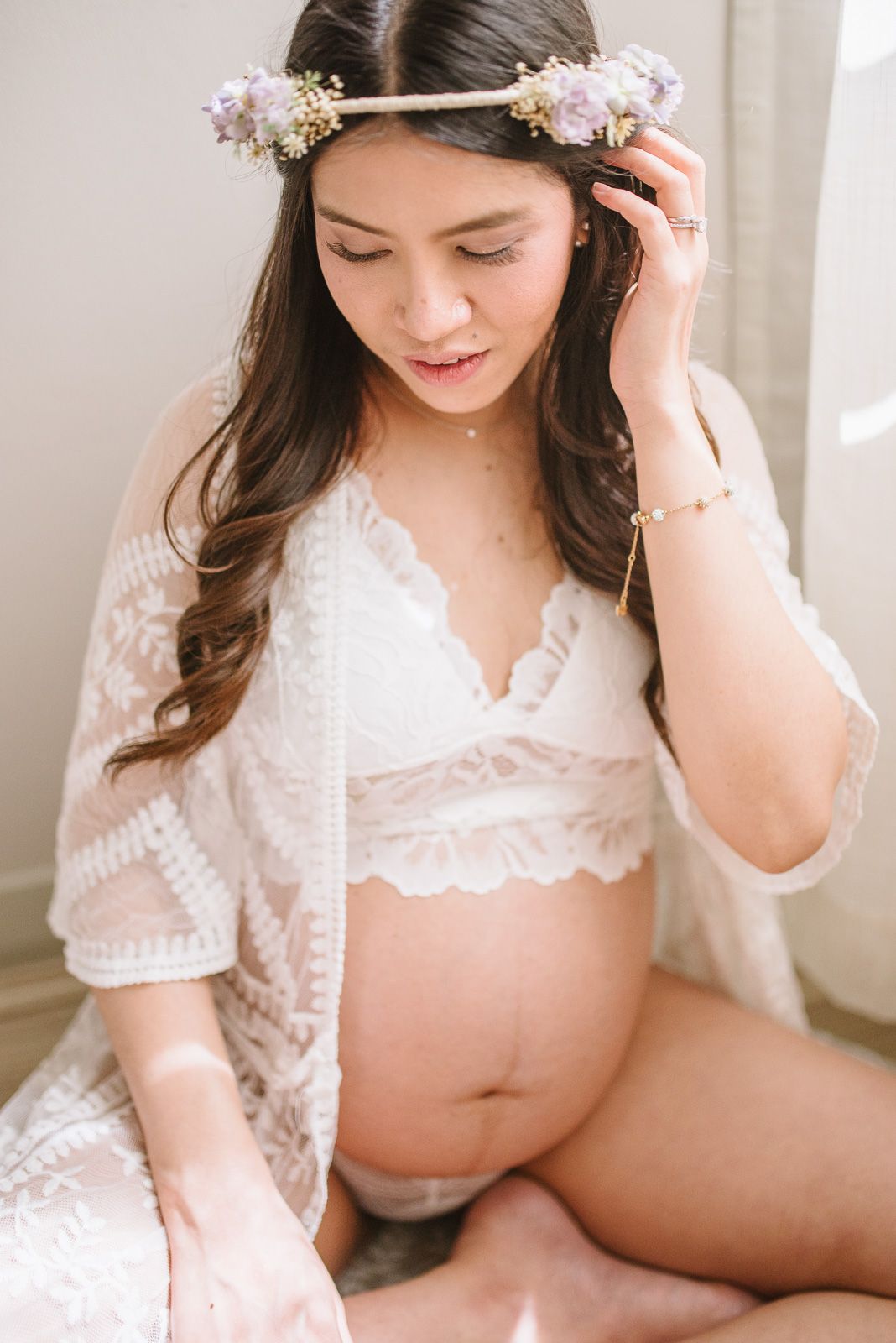 beautiful pregnant woman looking down