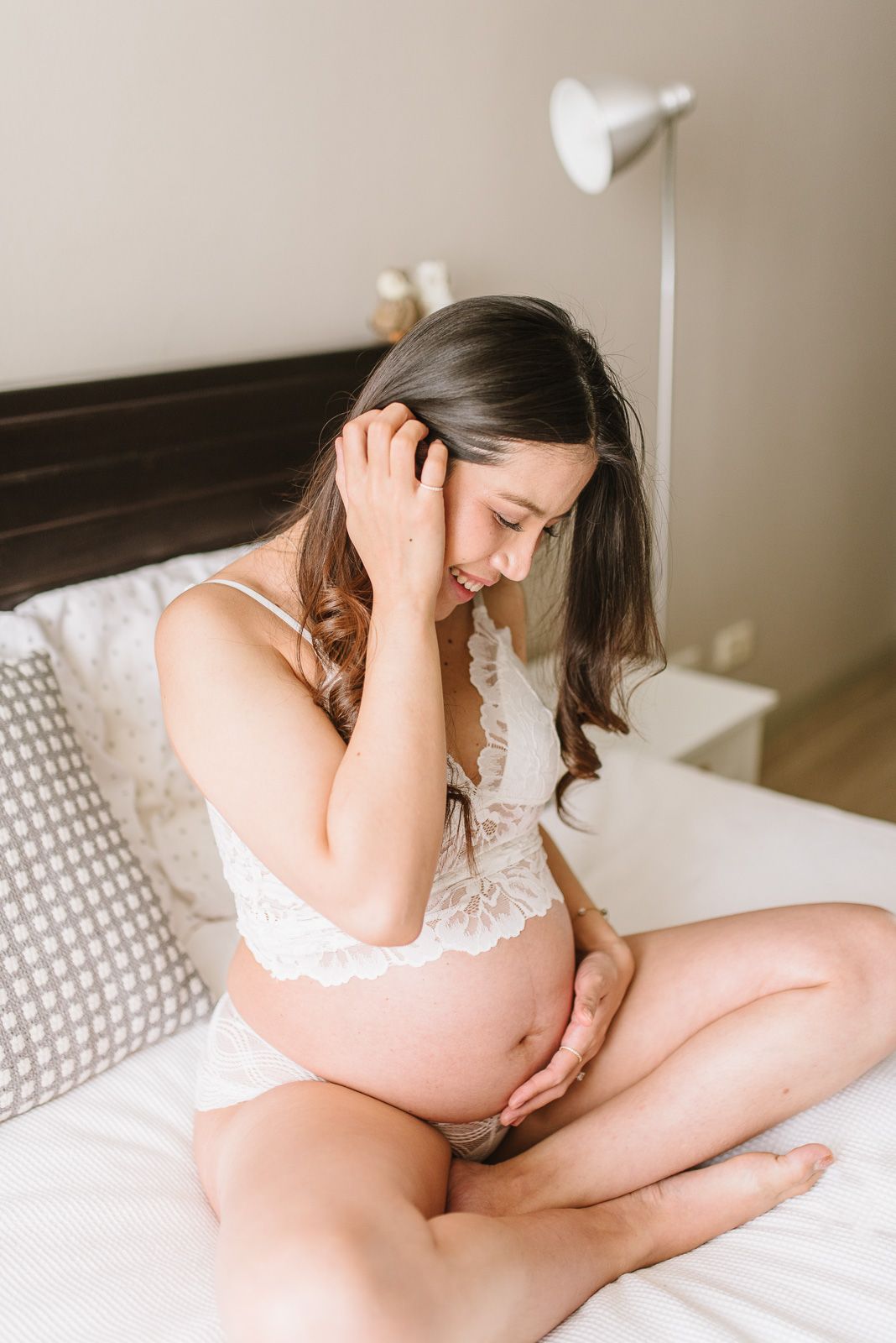 pregnant lady looking at her baby bump