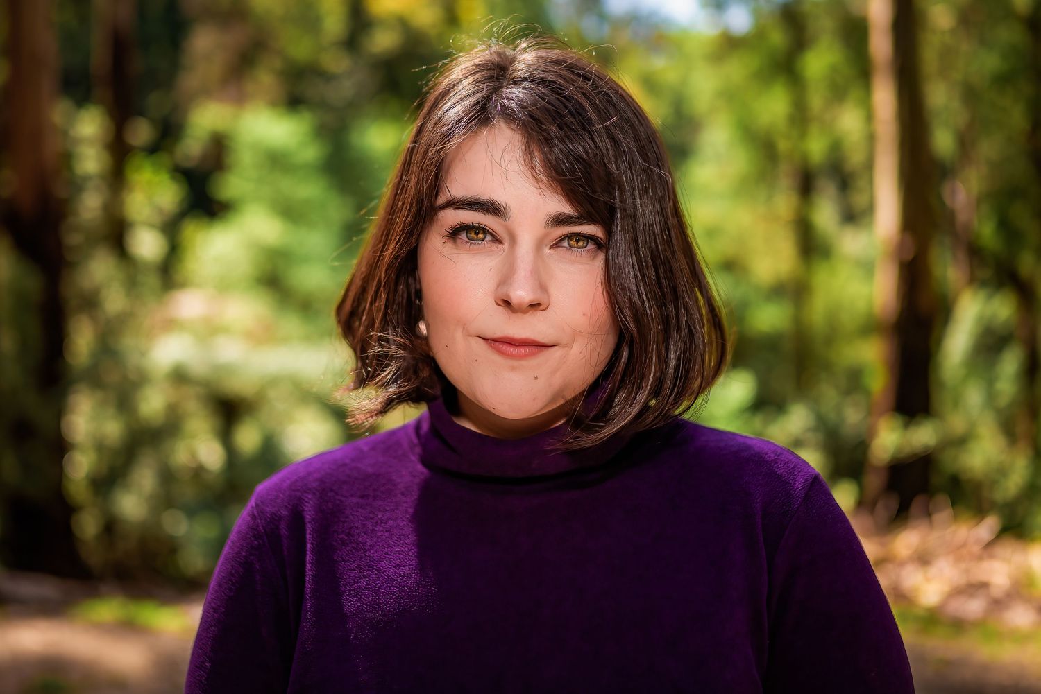 Female in purple jumper headshot at Sherbrooke in Alfred Nicholas Garden.