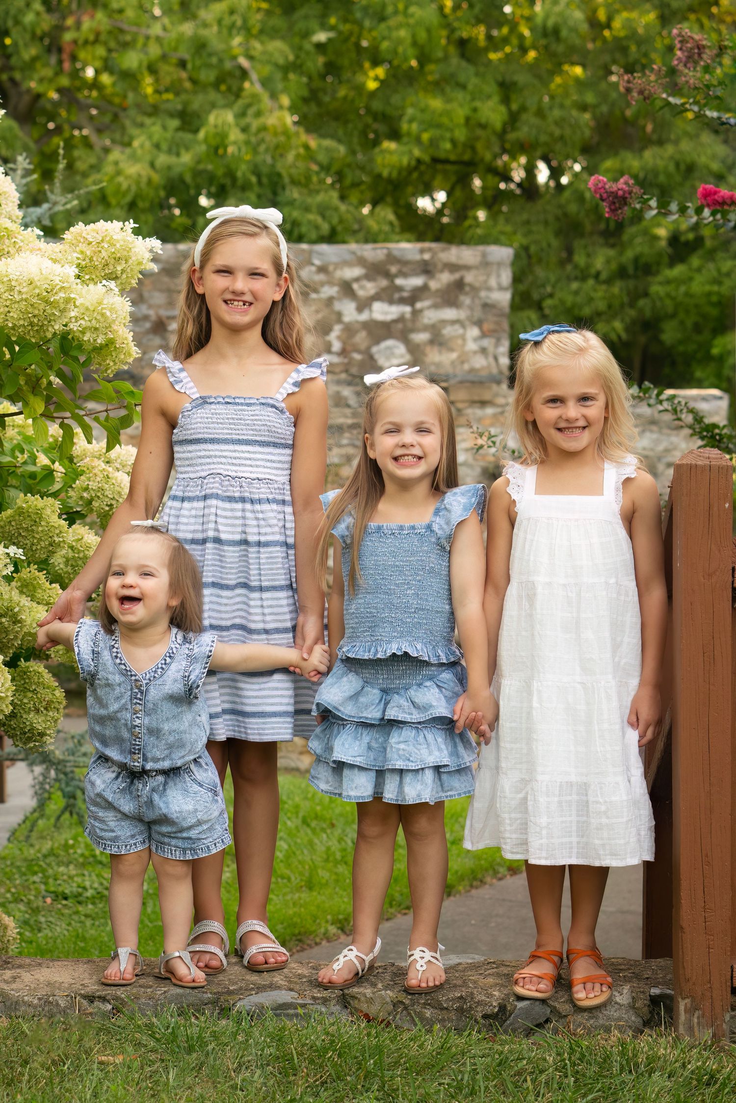 4 sisters smile in outdoor park area