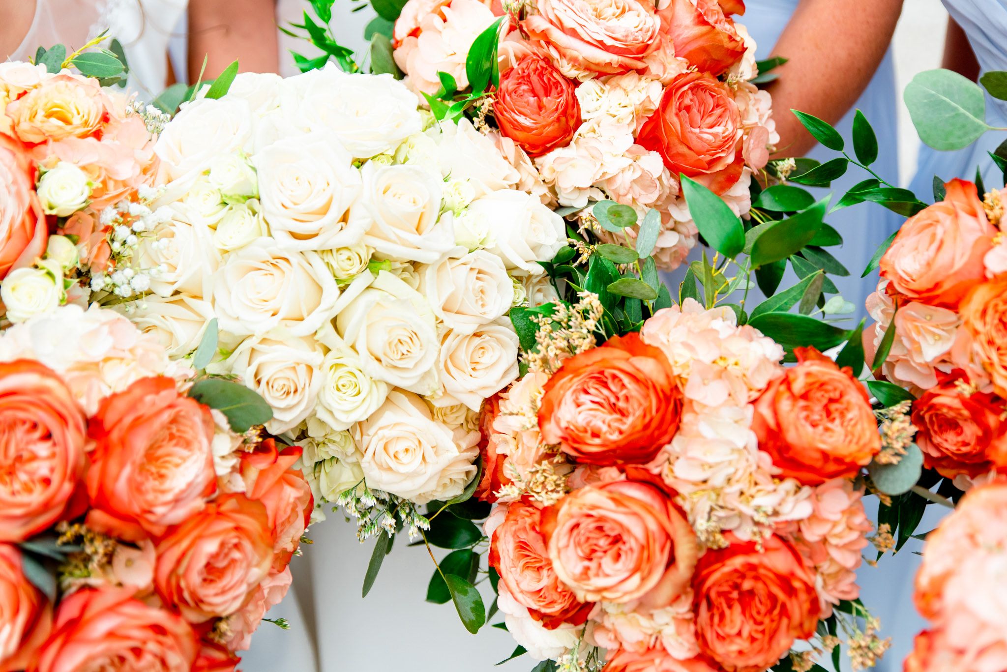 white and coral bridesmaids and bridal bouquets